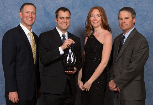 Award presentation photo at Carrier Factory Authorized Dealer 2013 National Meeting Caesar’s Palace Las Vegas, Nevada. Pictured from left to right: Chris Nelson, president, residential and commercial systems, Carrier; John Pritchett, president, C. Albert Matthews, Inc.; Rachel Pritchett, vice president, C. Albert Matthews, Inc.; David Meyer, vice president of residential marketing, Carrier.